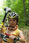 Woman Carrying Mountain Bike