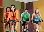 Group of People Using Exercise Bicycles