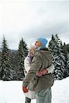 Couple embracing each other in snow