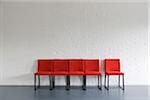 Red Chairs against Wall