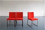 Red Chairs against Wall