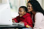 Mother and Son Using Computer