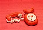 An old fashioned telephone with handset off the hook
