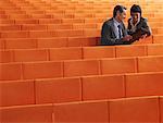 Business-Leute sitzen im Auditorium