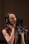 Woman Singing in Recording Studio