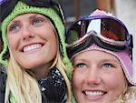 Two young blonde women in ski-wear, close-up, portrait