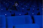 Man Sleeping in Movie Theatre