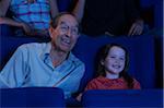 Grandfather and Granddaughter at Movie Theatre