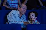 Grandfather and Grandson at Movie Theatre