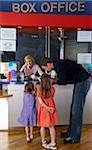 Father with Daughters at Movie Box Office