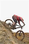 Mountain Biker Going Downhill