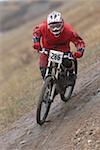 Mountain Biker Going Downhill