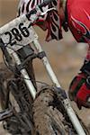 Mountain Biker Checking His Bike