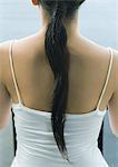 Woman's back and ponytail, close-up