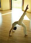 Woman doing one-legged bridge pose