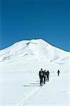 Group of skiers heading toward mountain