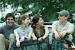 Group of hikers sitting in back of pick-up truck