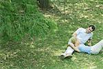 Couple reclining on grass