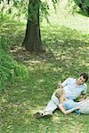 Couple reclining on grass