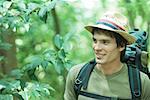 Hiker in forest, smiling