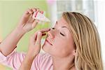 Woman Using Eye Drops