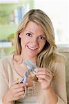 Woman Cutting Credit Card