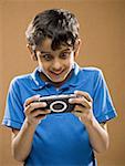 Boy holding video game smiling