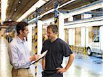 Men Talking in Automotive Plant