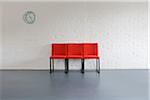 Red Chairs and Wall Clock