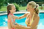 Mother and Daughter by Swimming Pool