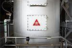 Danger Sign on Hatch in Water Treatment Plant