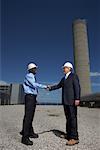 Businessmen Outside Factory