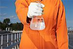 Man with Water Sample at Water Treatment Plant