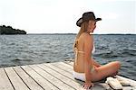 Woman Sitting on Dock