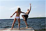 Woman Pushing Man Into Lake