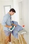 Man Ironing Clothes
