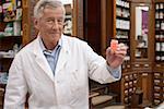 Pharmacist holding pills