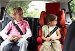 Children Listening to Music in Car