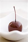 A cherry covered in chocolate