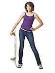 Girl standing and holding skateboard