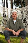 Man Sitting on Hammock