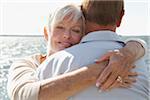 Couple Hugging by Water