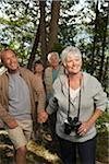 Couples Walking through Woods