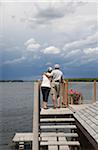 Couple Looking over Lake from Deck
