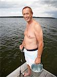 Man on Dock with Fishing Gear