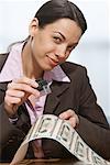 Businesswomen Inspecting Money