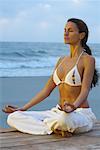 Woman Doing Yoga at Beach