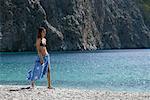 Woman Walking along Beach, Dodecanese, Greece