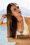 Woman Combing Hair on Beach, Dodecanese, Greece