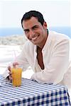 Man on Restaurant Patio, Dodecanese, Greece